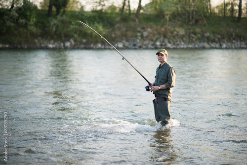 Fisherman fishing in a river
