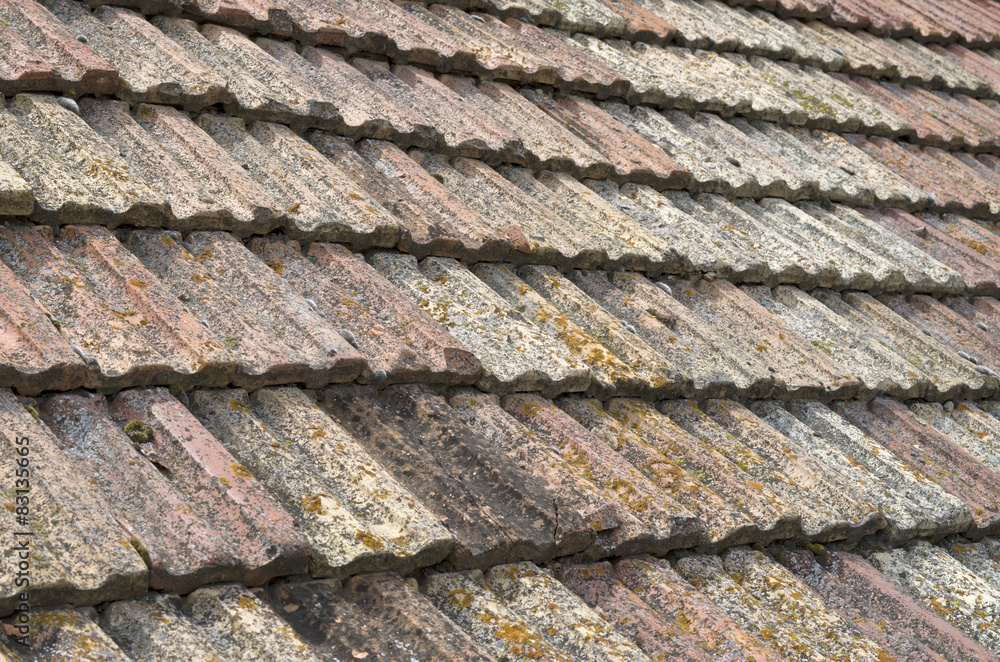 Old roof with ceramic tiles closeup