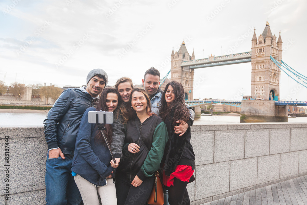 Group of friends enjoying taking a selfie in London