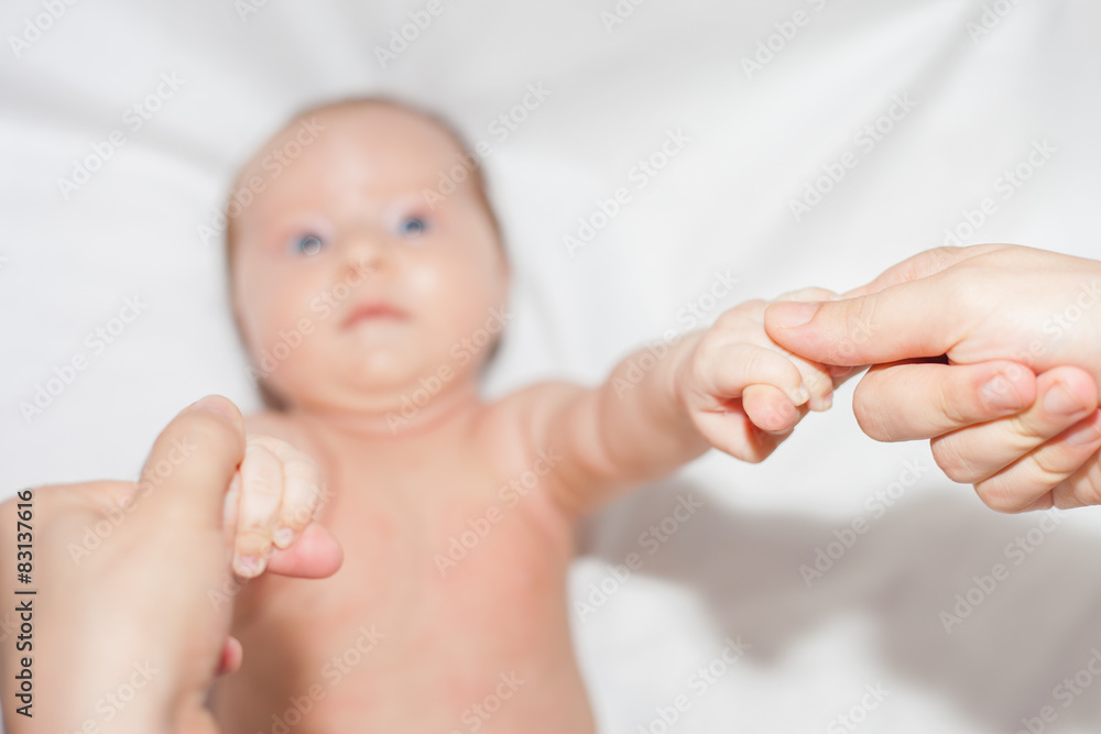 Mom checks grasping reflex month old baby Mom checks grasping reflex month old baby