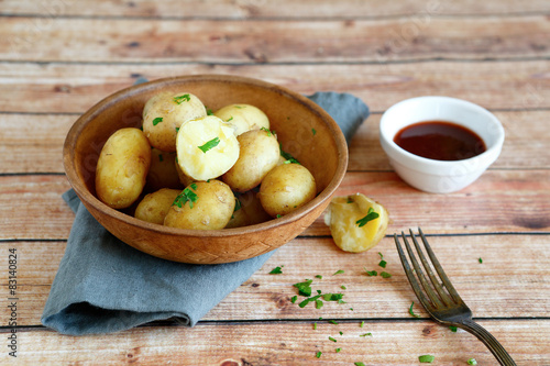 Tasty boiled potatoes in a clay bowl