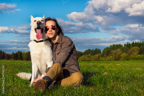 Young attractive girl with her pet dog photo