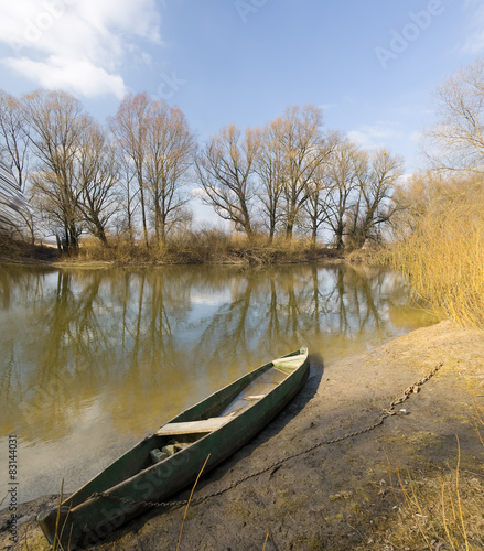 wooden boat on spring river. photo