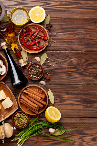 Various spices on wooden background