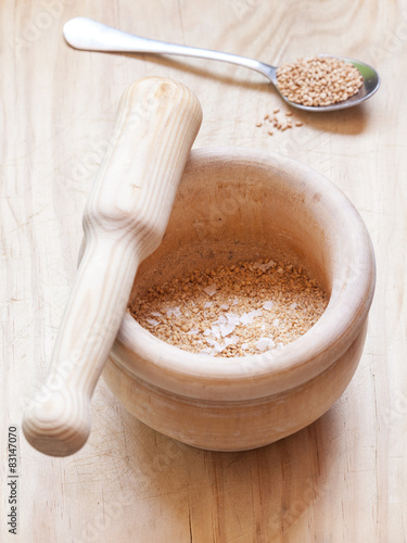 Close-up view of organic Gomasio in a ceramic bowl photo