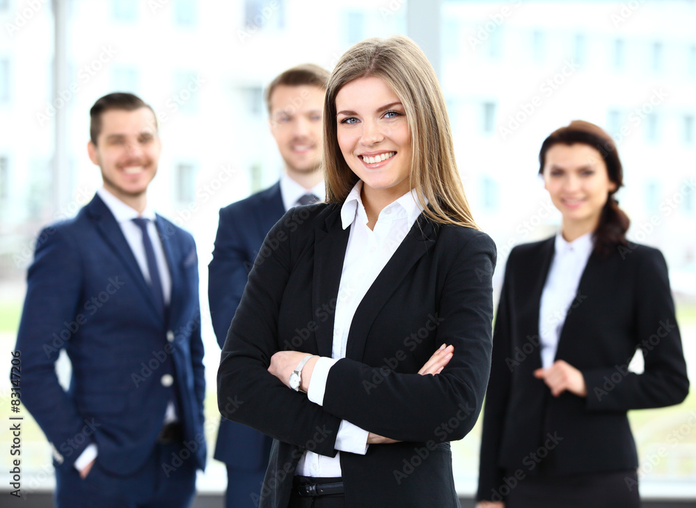 Face of beautiful woman on the background of business people Face of beautiful woman on the background of business people