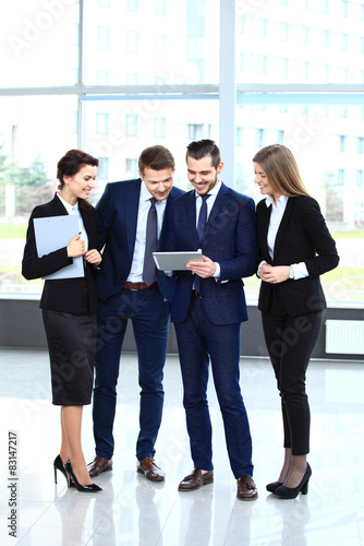 Image of business partners discussing documents and ideas  © opolja