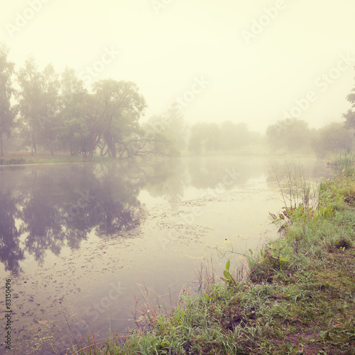 Autumn Landscape with River in Morning Fog