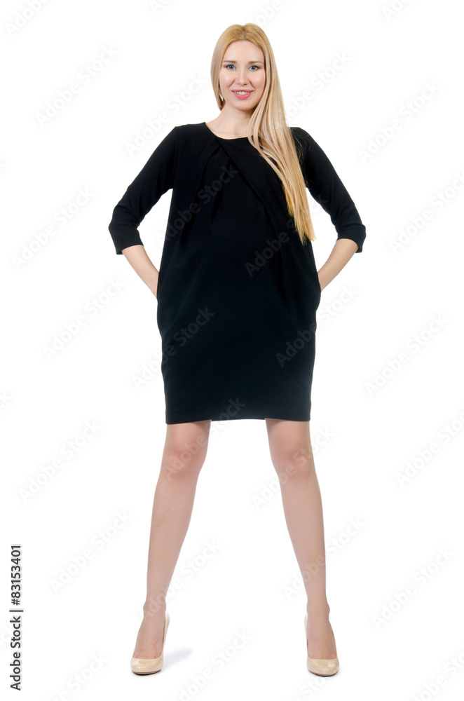 Fototapeta premium Pretty pregnant woman in mini black dress isolated on white