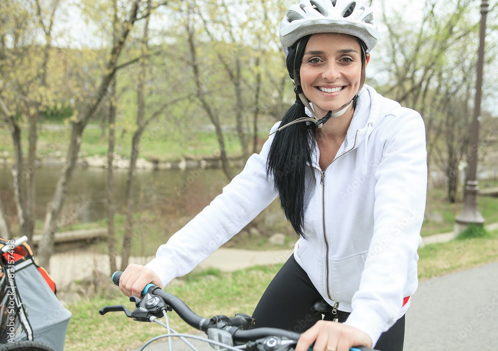 Beautiful young slim woman riding a bicycle Beautiful young slim woman riding a bicycle