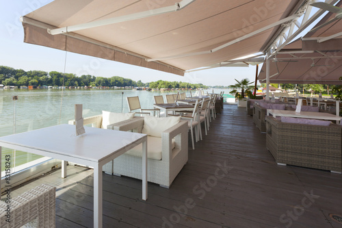 Modern riverside cafe terrace photo