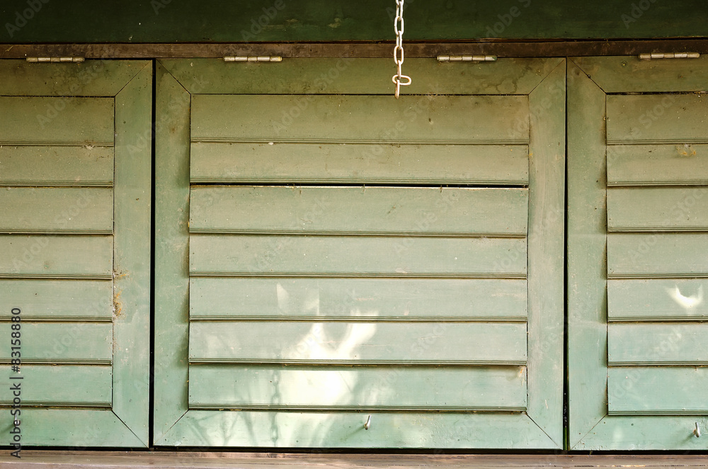 Closed green wooden windows Closed green wooden windows
