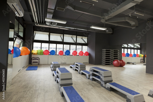Step boards and pilates balls in gym