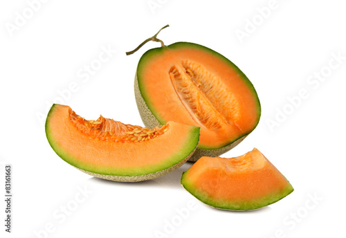 ripe orange melon with stem on white background
