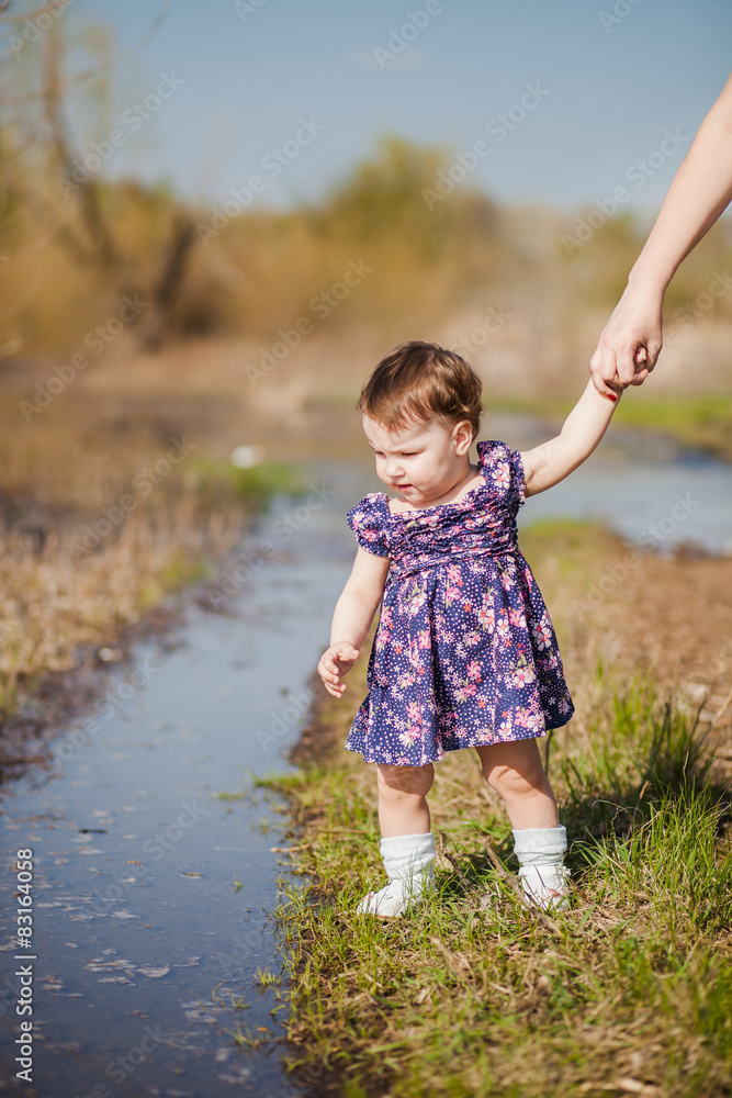 the little girl holds a hand the little girl holds a hand
