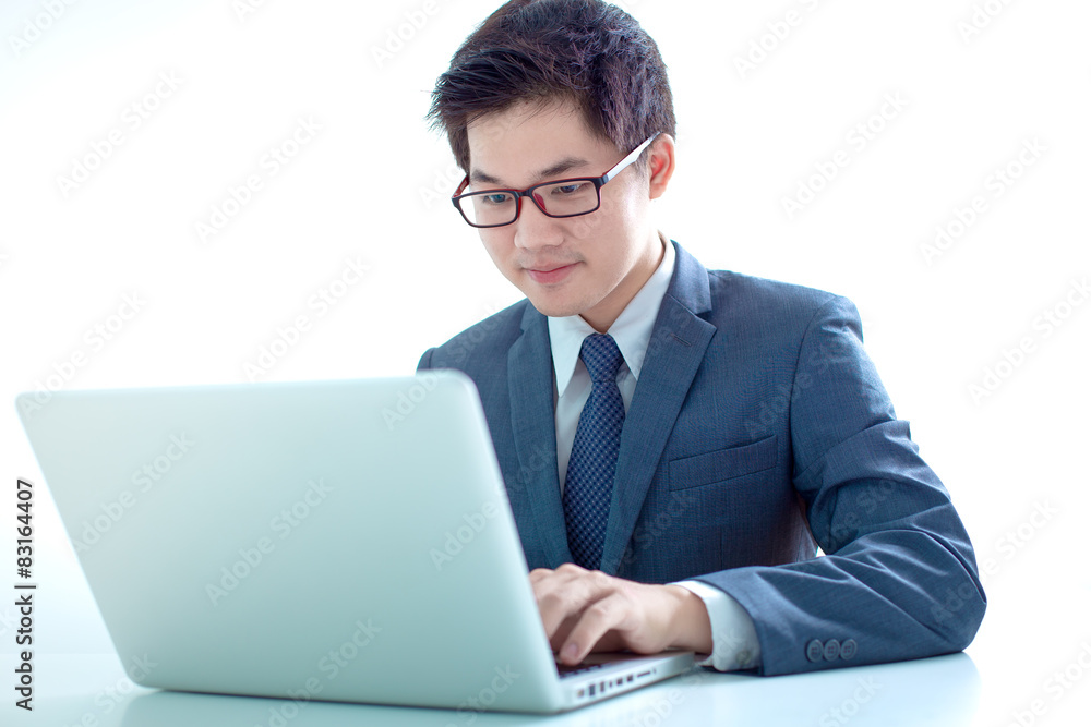Handsome businessman working with laptop Handsome businessman working with laptop