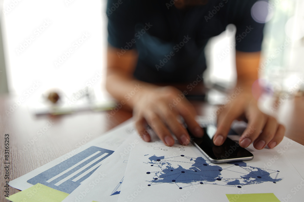 business documents on office table with smart phone and digital business documents on office table with smart phone and digital
