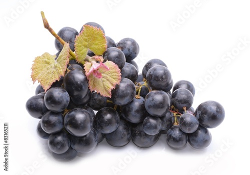 Red grapes with leaf isolated on white background