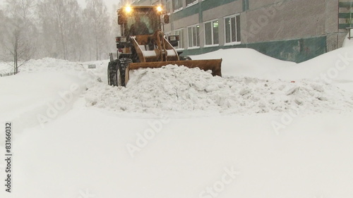 Snowplow removes a lot of snow in the 