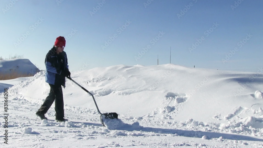 Man shoveling snow from the road Man shoveling snow from the road