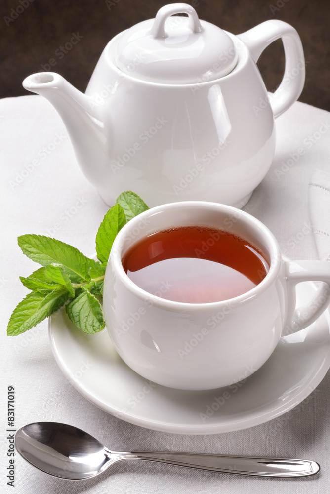 Tea, teapot and mint leaves