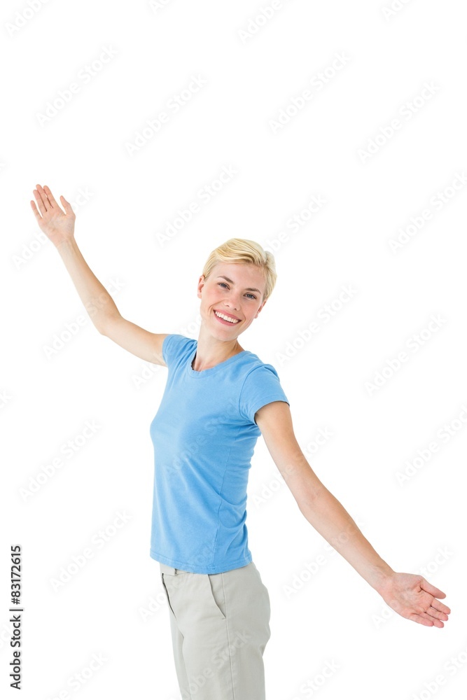 Blonde woman standing arms outstretched Blonde woman standing arms outstretched