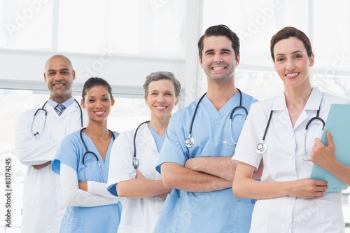 Team of smiling doctors looking at camera