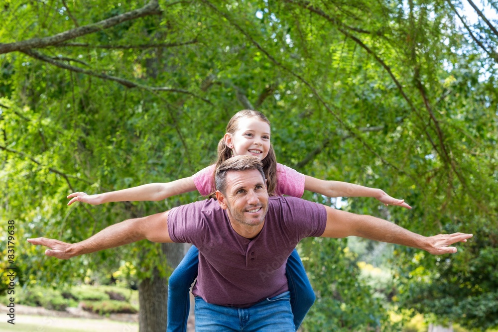 Father and daughter having fun in the park Father and daughter having fun in the park