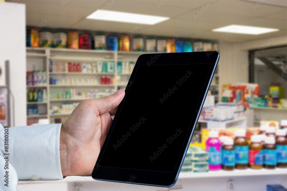 Composite image of man using tablet pc Composite image of man using tablet pc