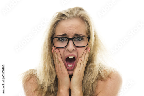 Attractive young woman with a horrified expression photo