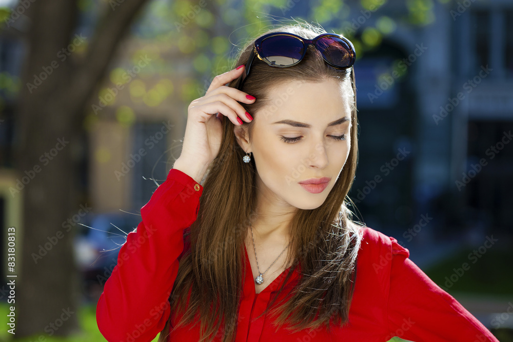 Portrait of young woman on summer street Portrait of young woman on summer street