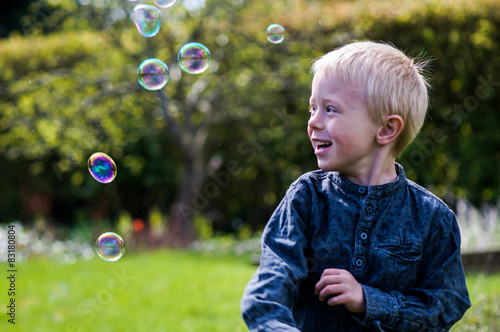 Child and Soap Bubbles