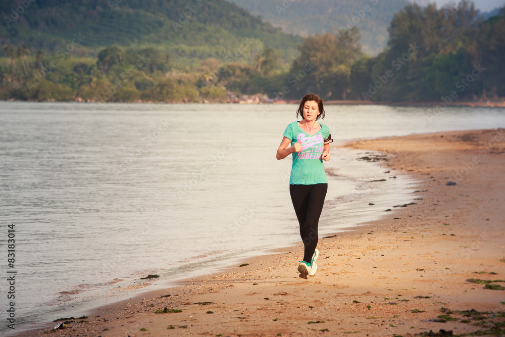 girl runs on beach at low tide