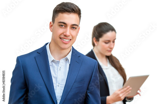 Young businessman with partner in background.