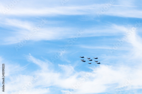 military low-flying aircrafts in white clouds