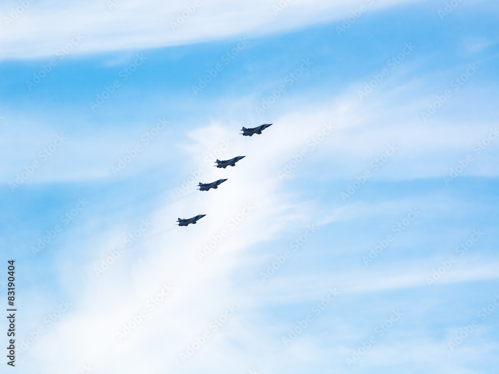 four military fighter planes in cloudy sky four military fighter planes in cloudy sky