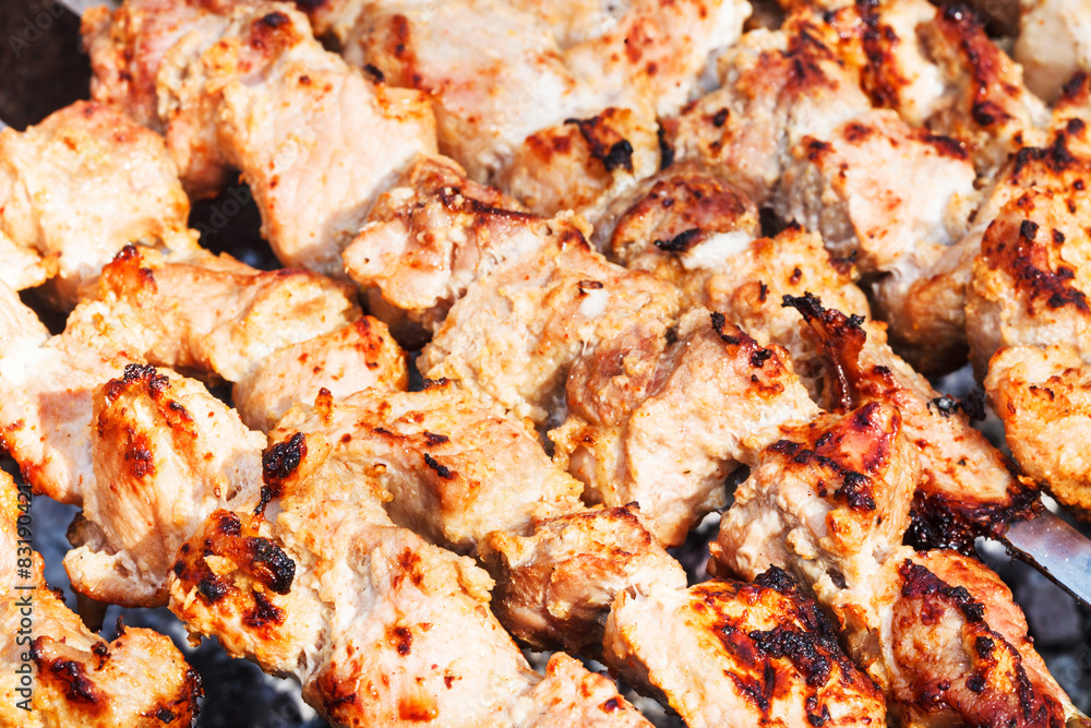 pieces of shish kebabs on skewers on gril pieces of shish kebabs on skewers on gril