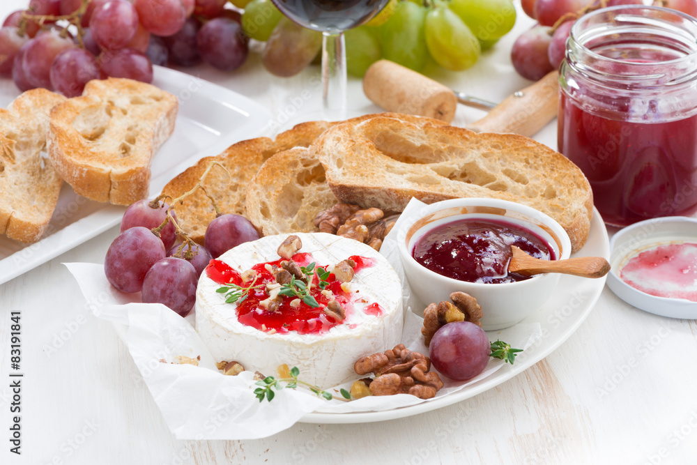 appetizers for wine - camembert with berry jam, toast and fruit appetizers for wine - camembert with berry jam, toast and fruit