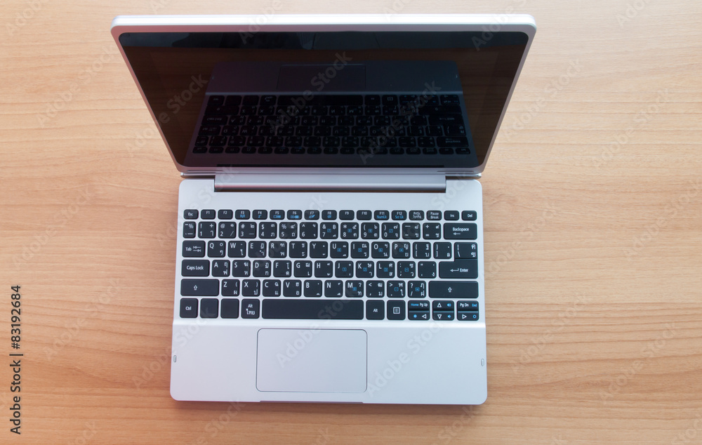 Business office desk, laptop on wooden table Business office desk, laptop on wooden table