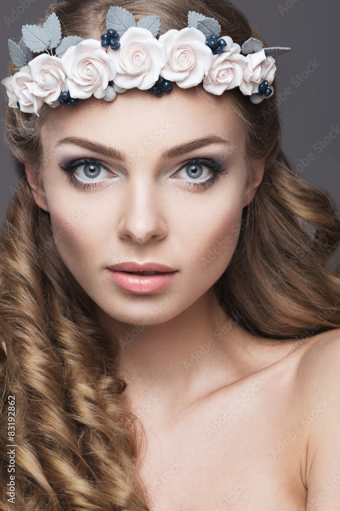 girl in the image of a bride with flowers in her hair.