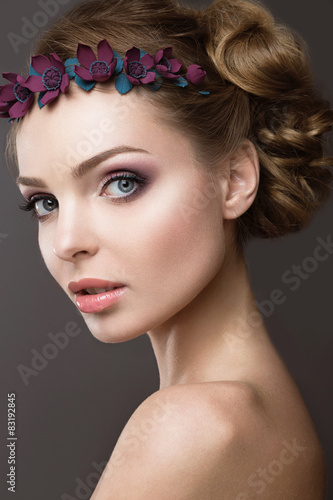 girl in the image of a bride with flowers in her hair.