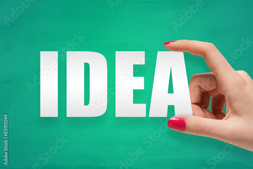 Woman hand holding the word idea