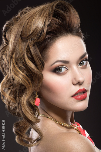 Photos Beautiful girl with evening hairstyle and bright makeup