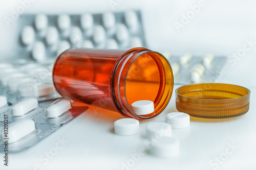 pills in pill bottle with blister pack medicine