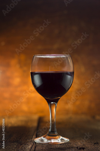 Wine glass and Bottle on a wooden background