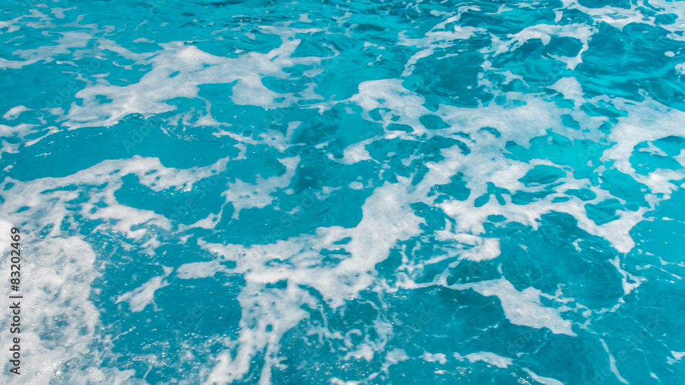 Boat Wake Prop Wash in Clear Blue Ocean Sea in Sunny Day Boat Wake Prop Wash in Clear Blue Ocean Sea in Sunny Day