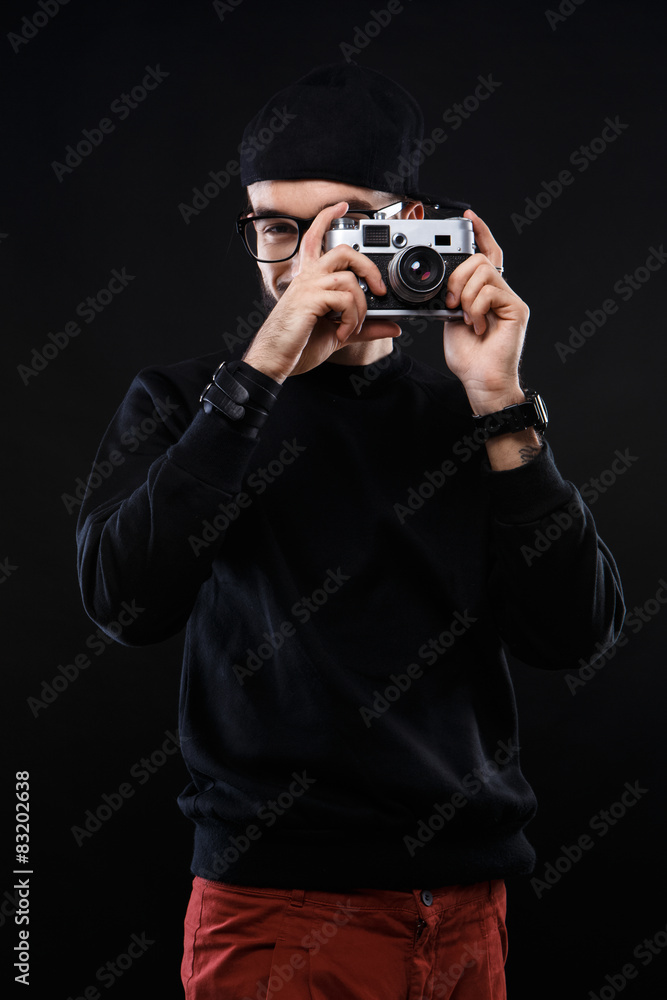 Charismatic guy in sweater , glasses photo camera Charismatic guy in sweater , glasses photo camera