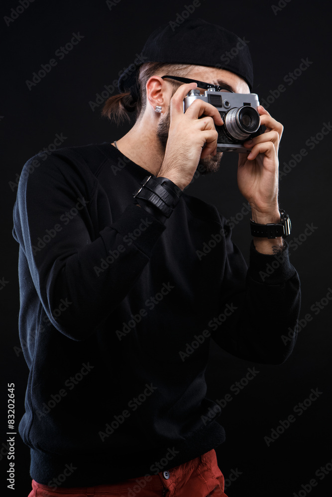 Charismatic guy in sweater , glasses photo camera Charismatic guy in sweater , glasses photo camera