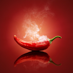 Acrylglasbilder Küche Dampfende rote Chilischote Nahaufnahme  © JohanSwanepoel