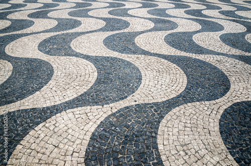 Typical portuguese cobblestone hand-made pavement in Portugal, L